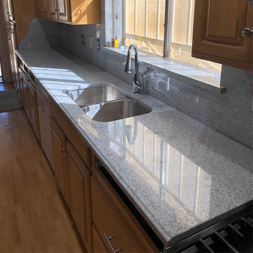 Grey Granite kitchen landing area made b Empire Granite & Stone LLC