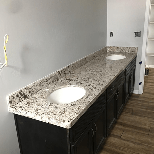 His and her sink countertop made of granite by Empire Granite & Stone LLC