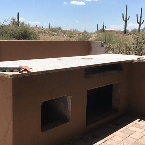 Outside kitchen countertop made of granite, house located in Tucson