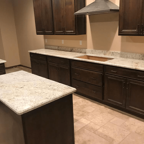 Matching stone countertop and kitchen landing area for house by empire granite and stone