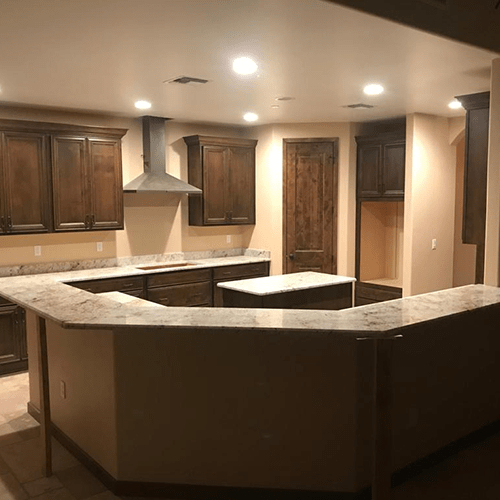 Kitchen countertops made of granite for a L-shaped kitchen set up by Empire Granite and Stone